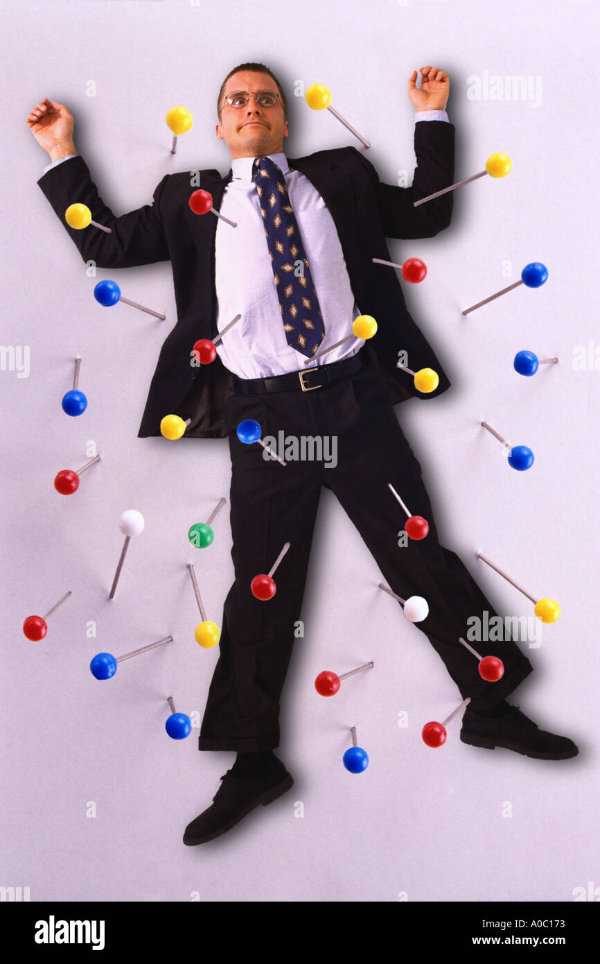 Businessman push pinned to wall Stock Photo - Alamy, image size:866x1390