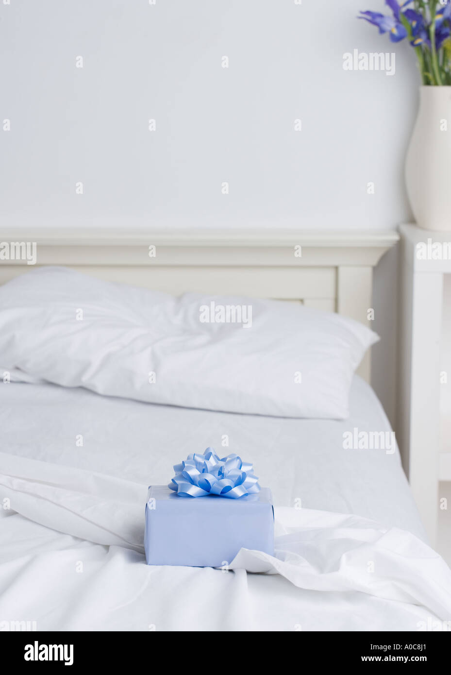 Still life of gift box on bed Stock Photo
