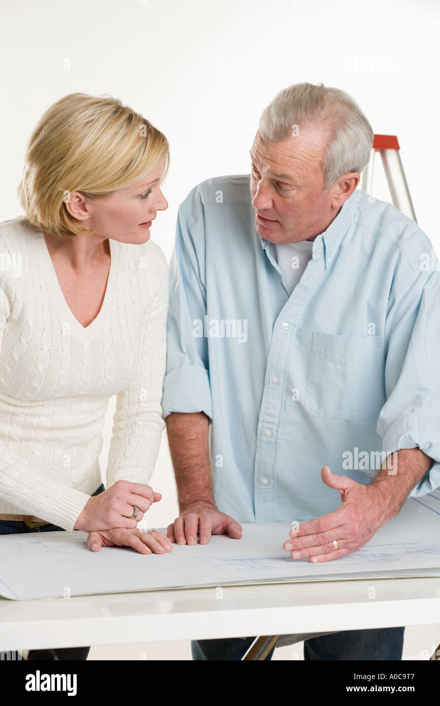 Couple working on their home Stock Photo