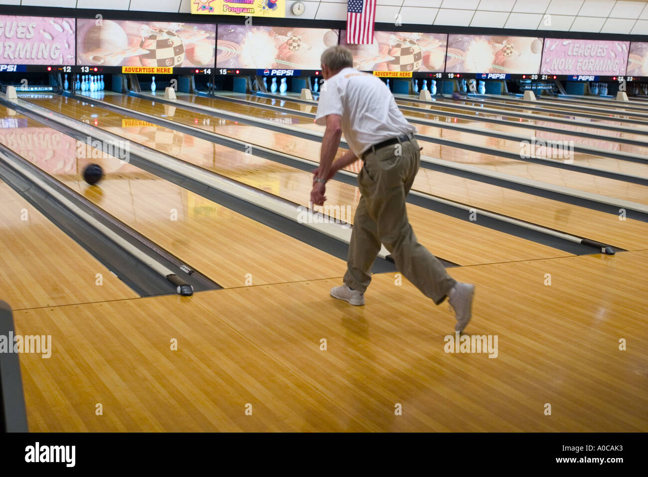 Older man bowling Stock Photo Alamy