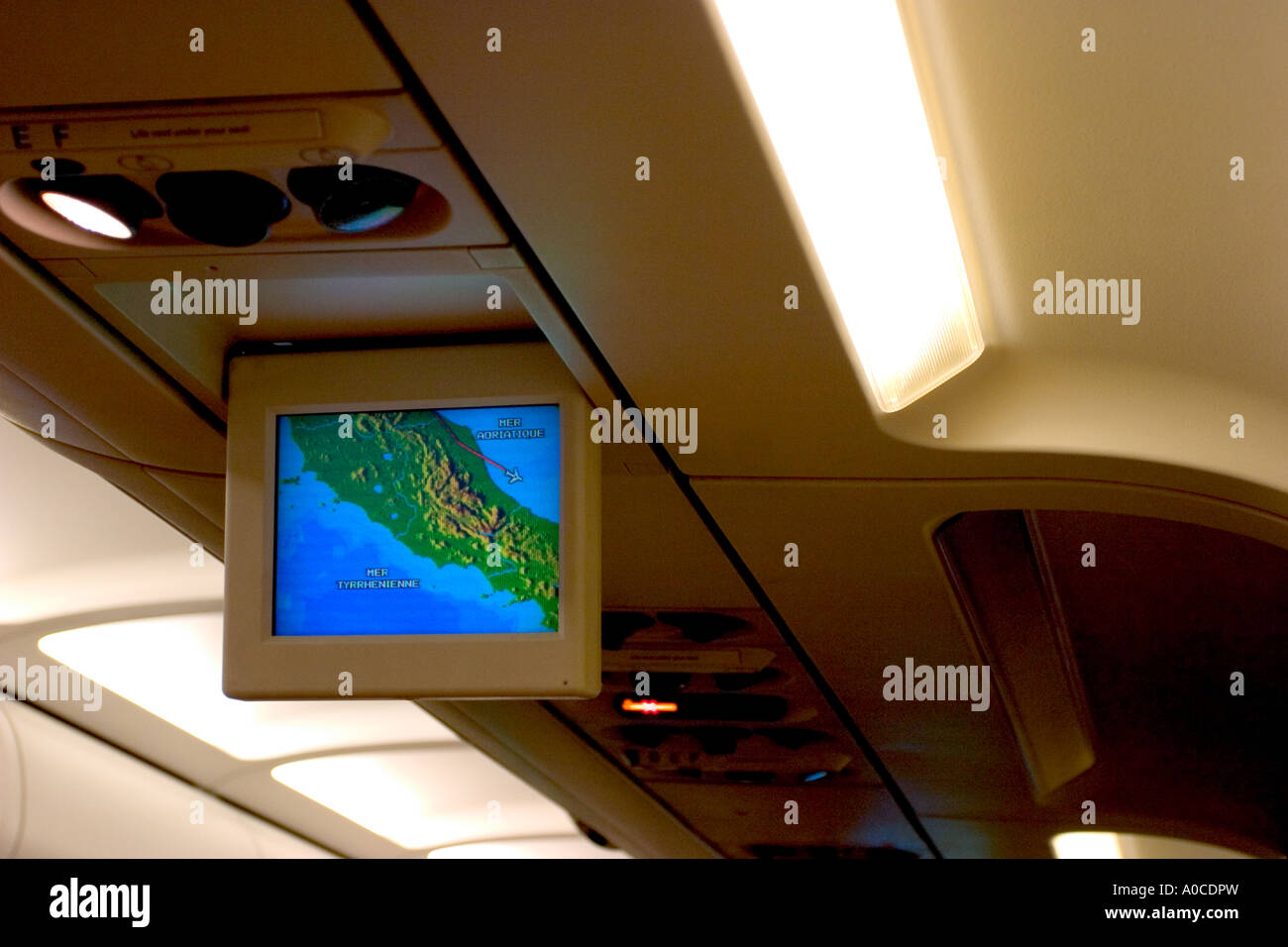 inside airplane and mini tv monitor Stock Photo