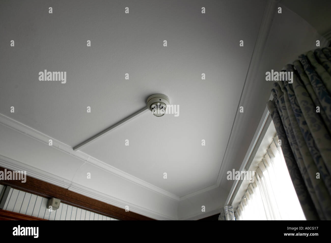 Smoke detector fire alarm on ceiling of hotel room, Copenhagen, Denmark Stock Photo