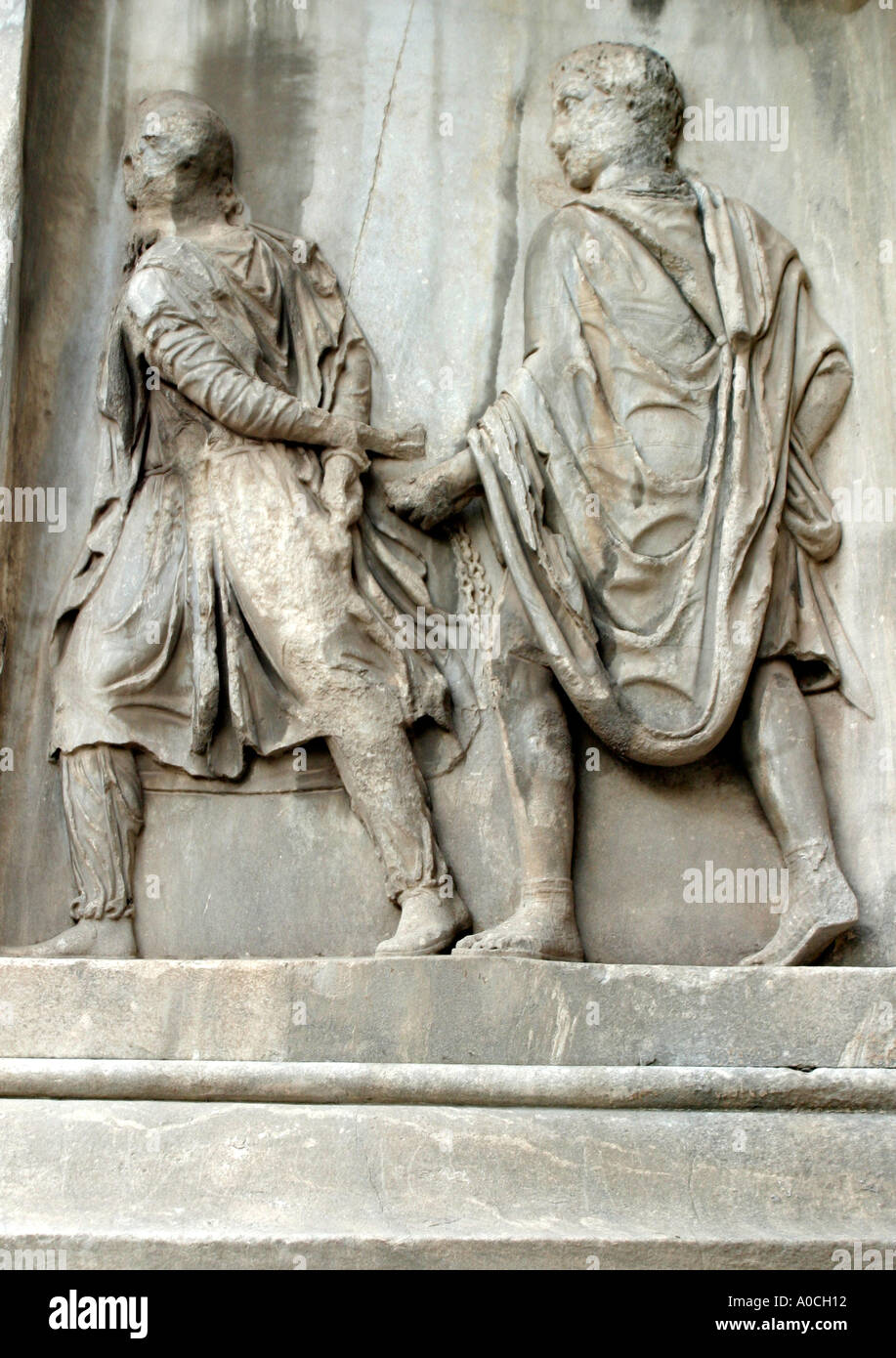 Relief of prisoner being dragged away in chains Arch of Septimus Severus Roman Forum Rome Stock Photo