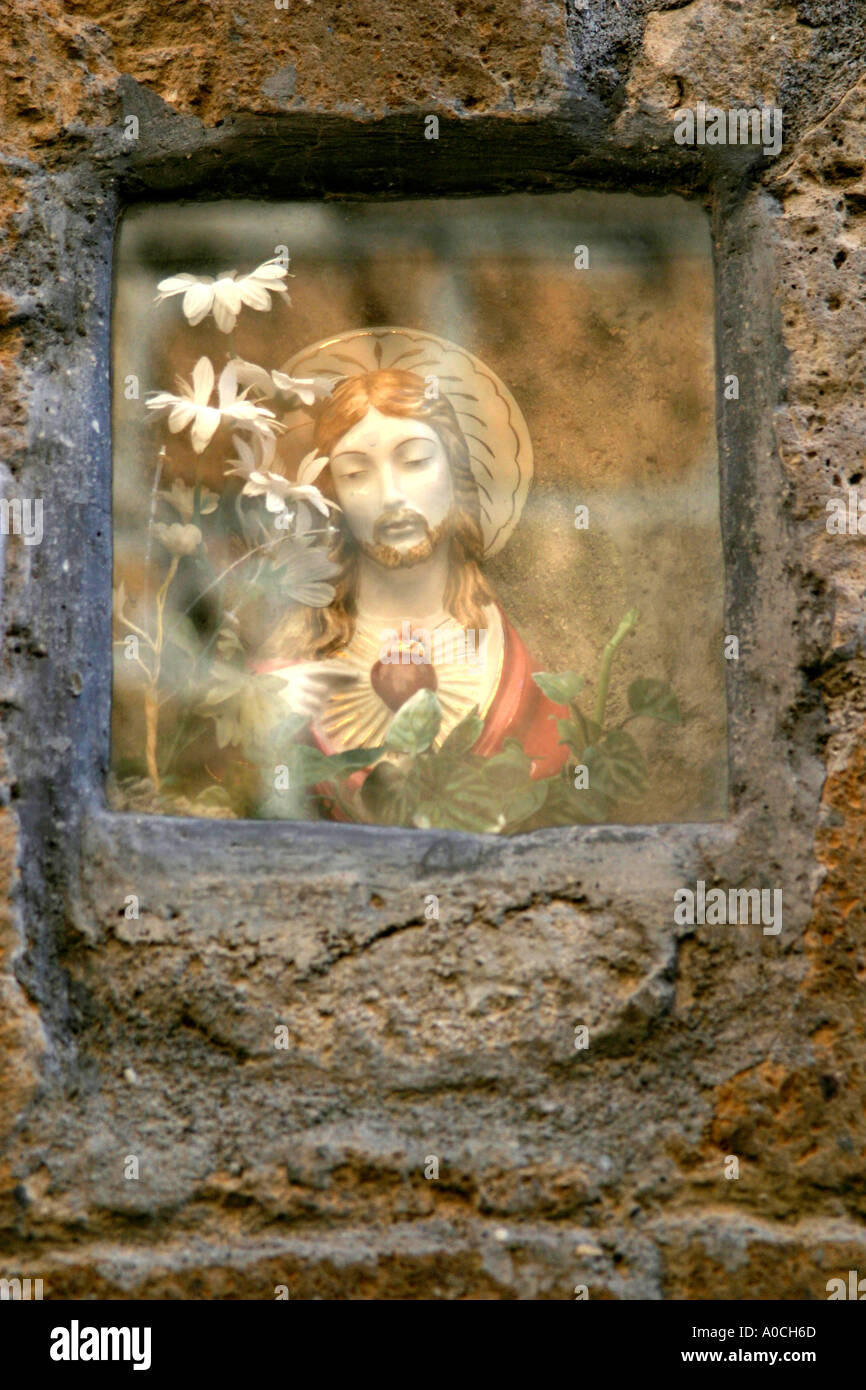 Jesus in a glass box on the street Pitigliano Italy Stock Photo