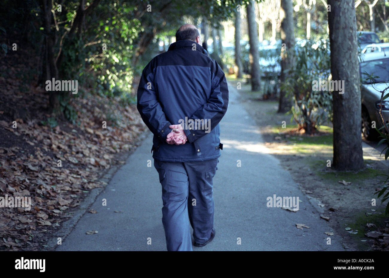 Lonely middle aged man walking hi-res stock photography and images - Alamy