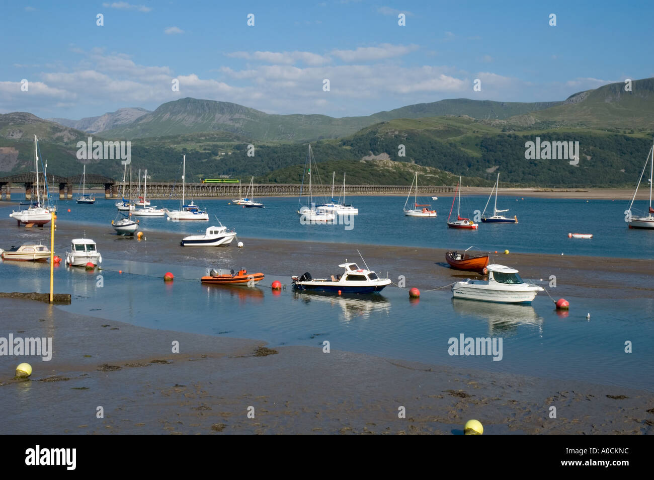 Yachts in river estuary at low tide Stock Photo