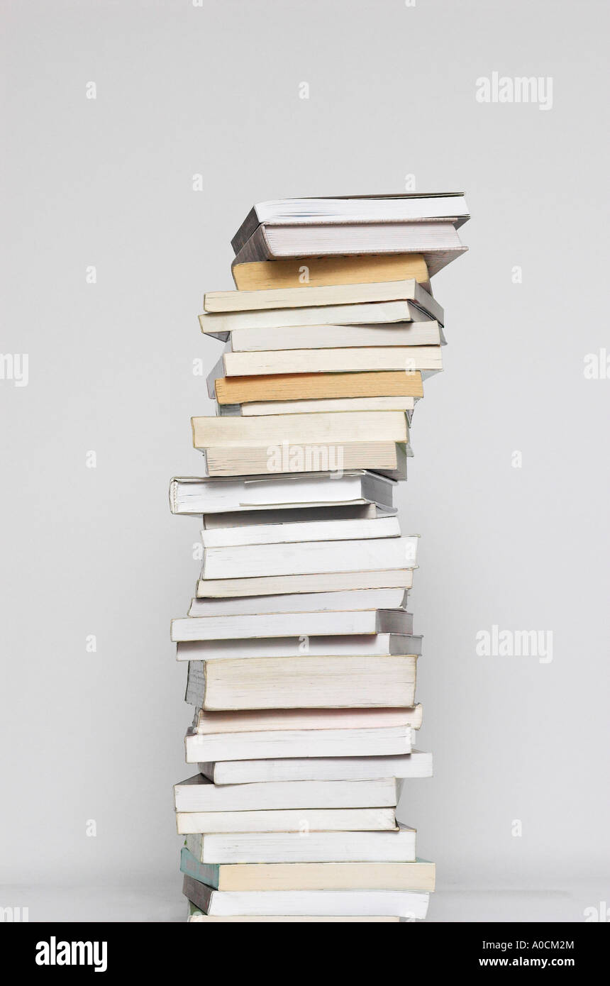 Stacked text books against white background Stock Photo