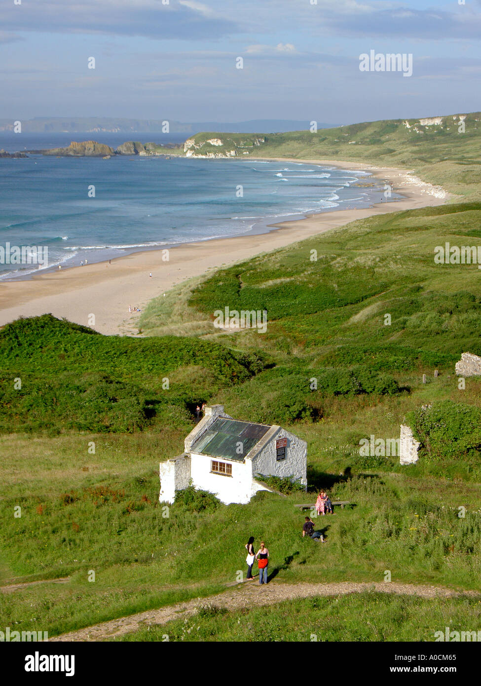 White Park Bay on the Giants Causeway Coast of County Antrim, Northern Ireland. Rathlin Island in distance. Summer Stock Photo