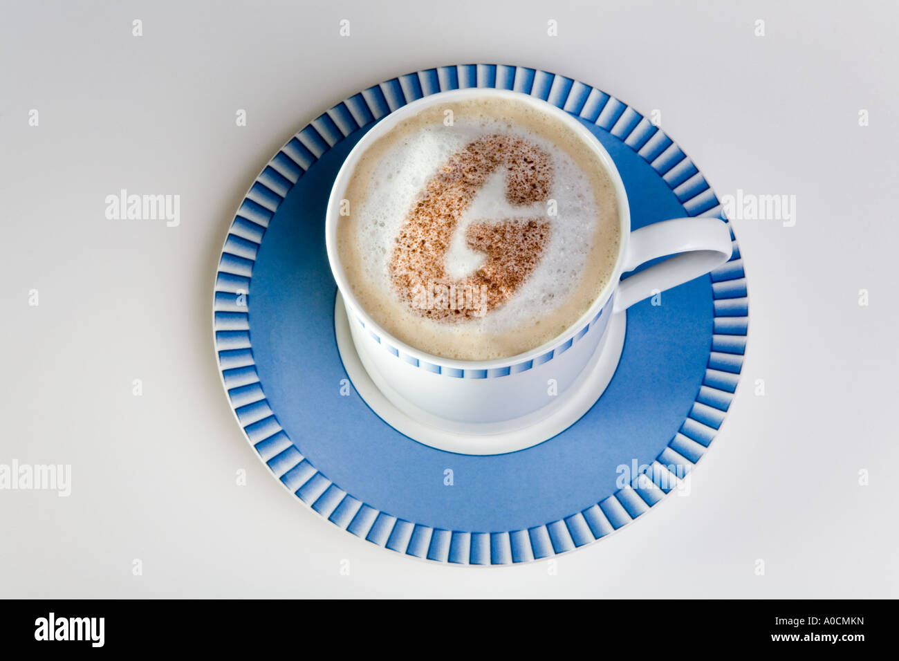 letter g in froth of cup of hot cappuccino coffee Stock Photo