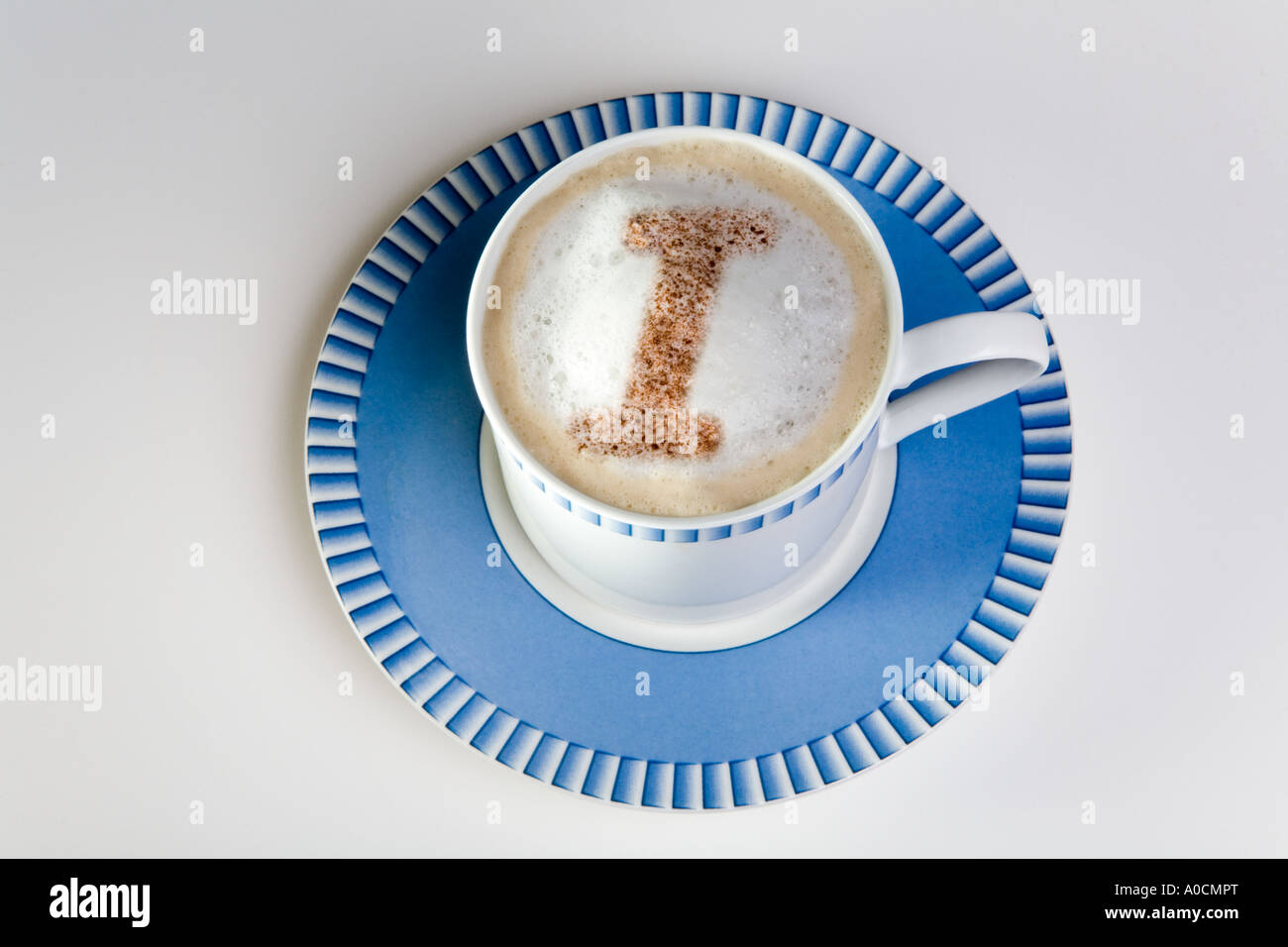 letter i in froth of cup of hot cappuccino coffee Stock Photo