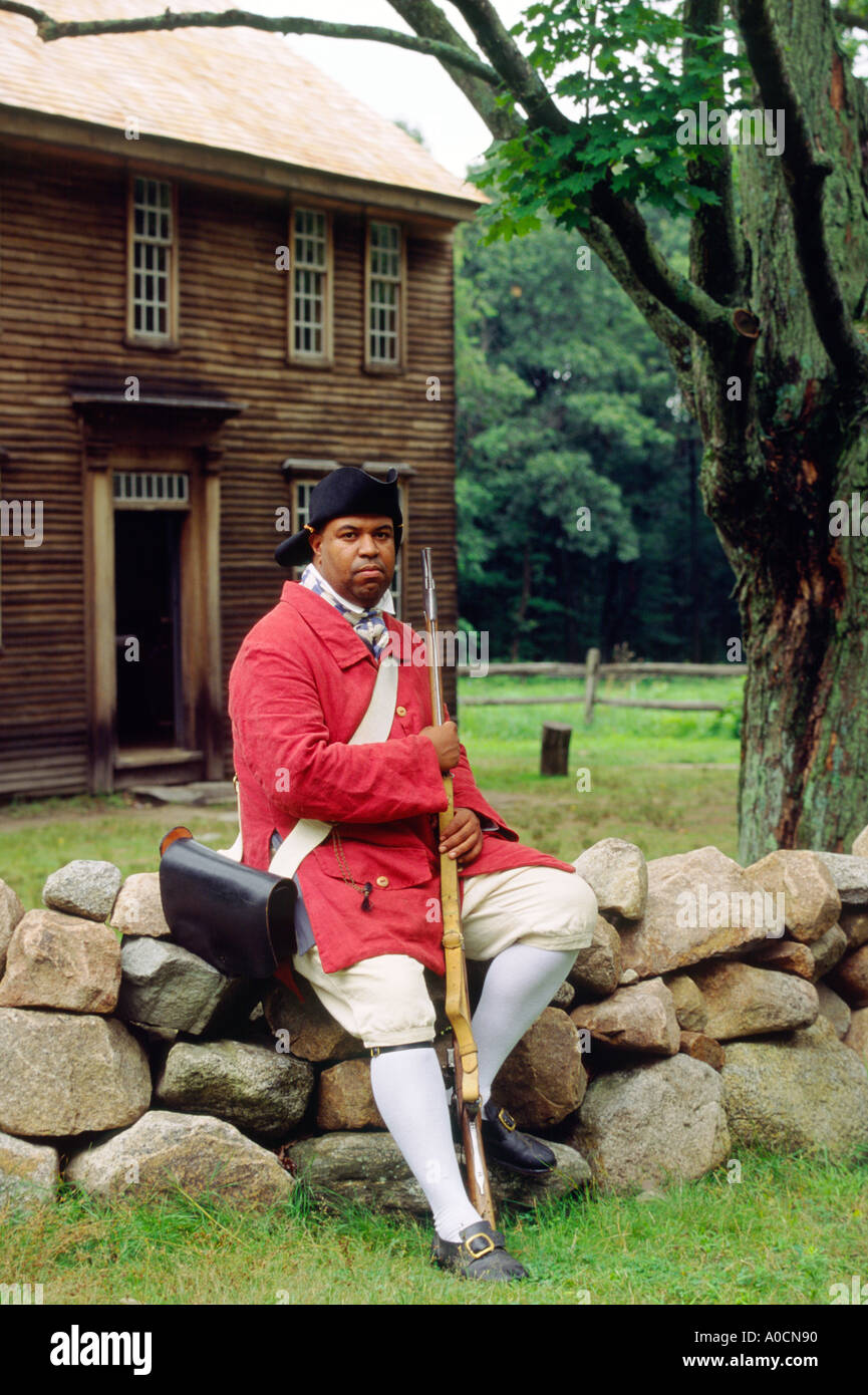 Minuteman National Historical Park, Concord, Massachusetts. Revolutionary War freed slave patriot in front of Hartwell Tavern Stock Photo