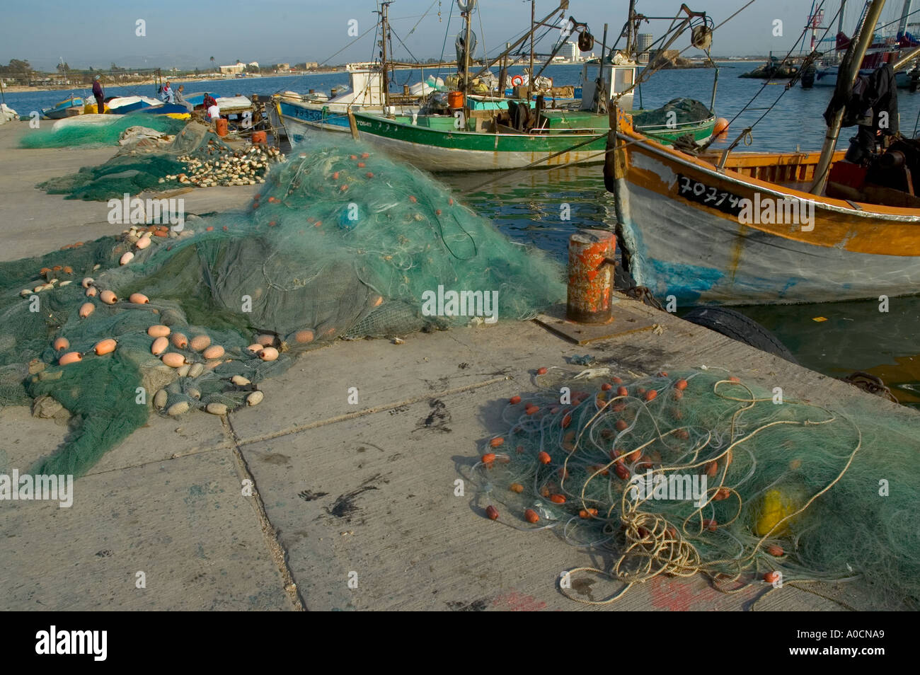 Israel Akko old city the old harbour fishing nets and fishing boats  Stock Photo