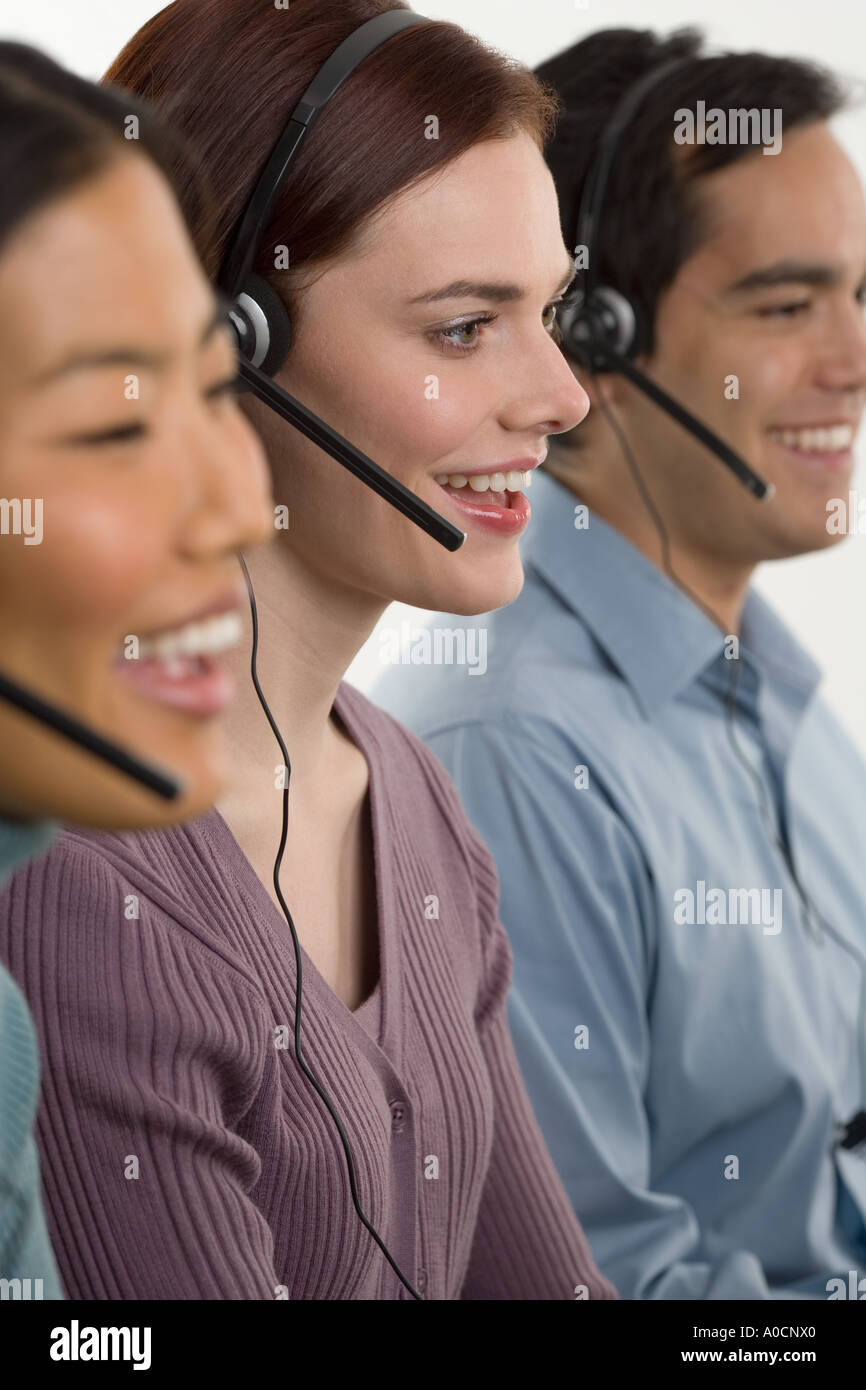 Phone operators using headsets Stock Photo Alamy