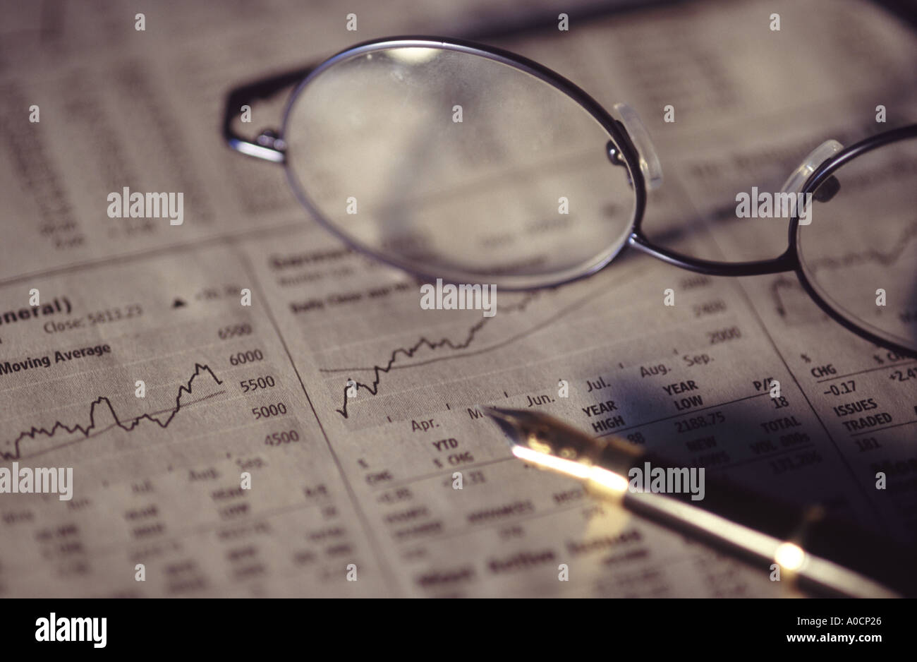 newspaper with glasses on top Stock Photo