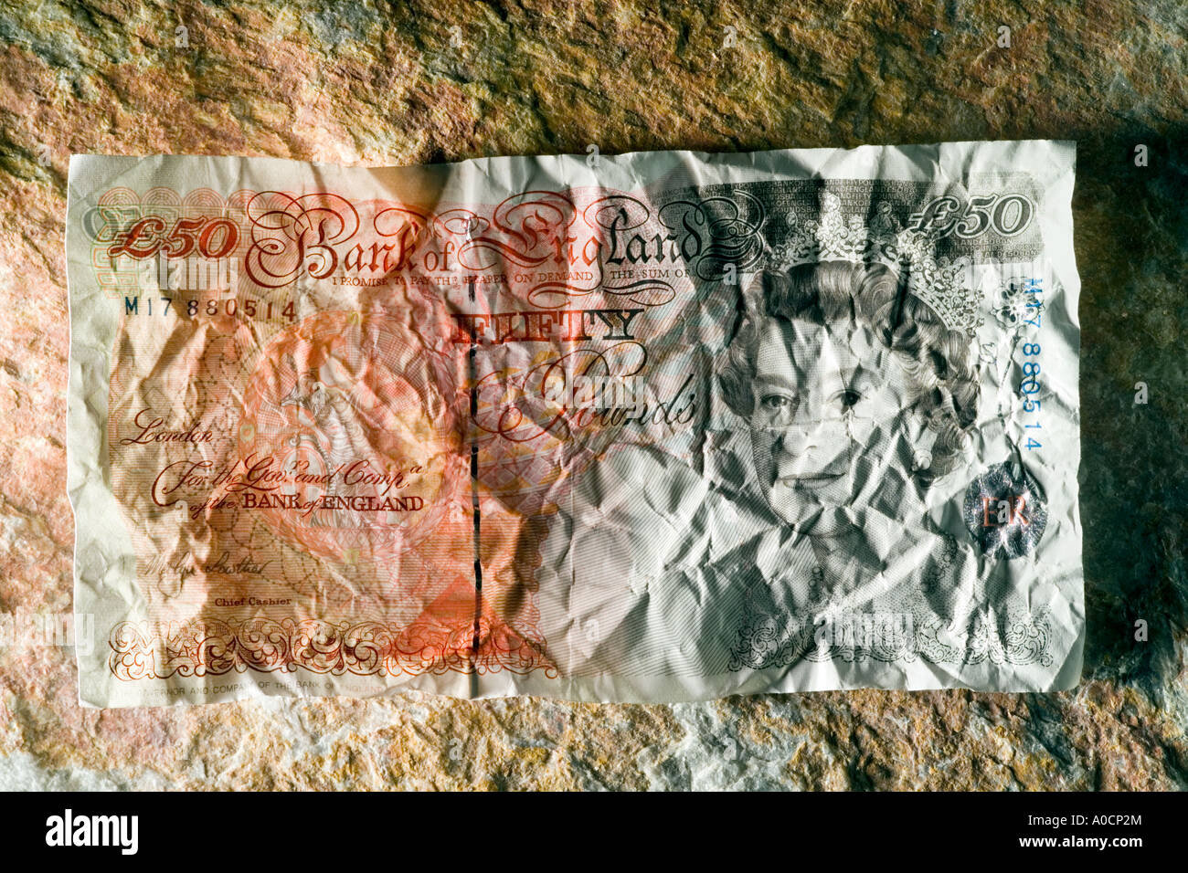 50 fifty pound bank note on rock Stock Photo - Alamy