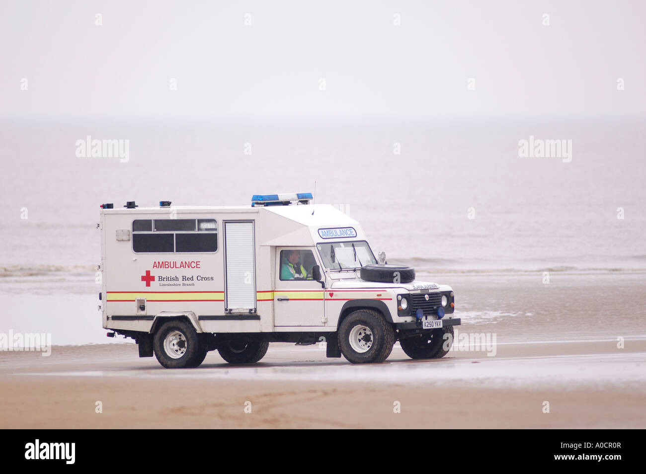Red cross ambulance on a beach in england Stock Photo Alamy