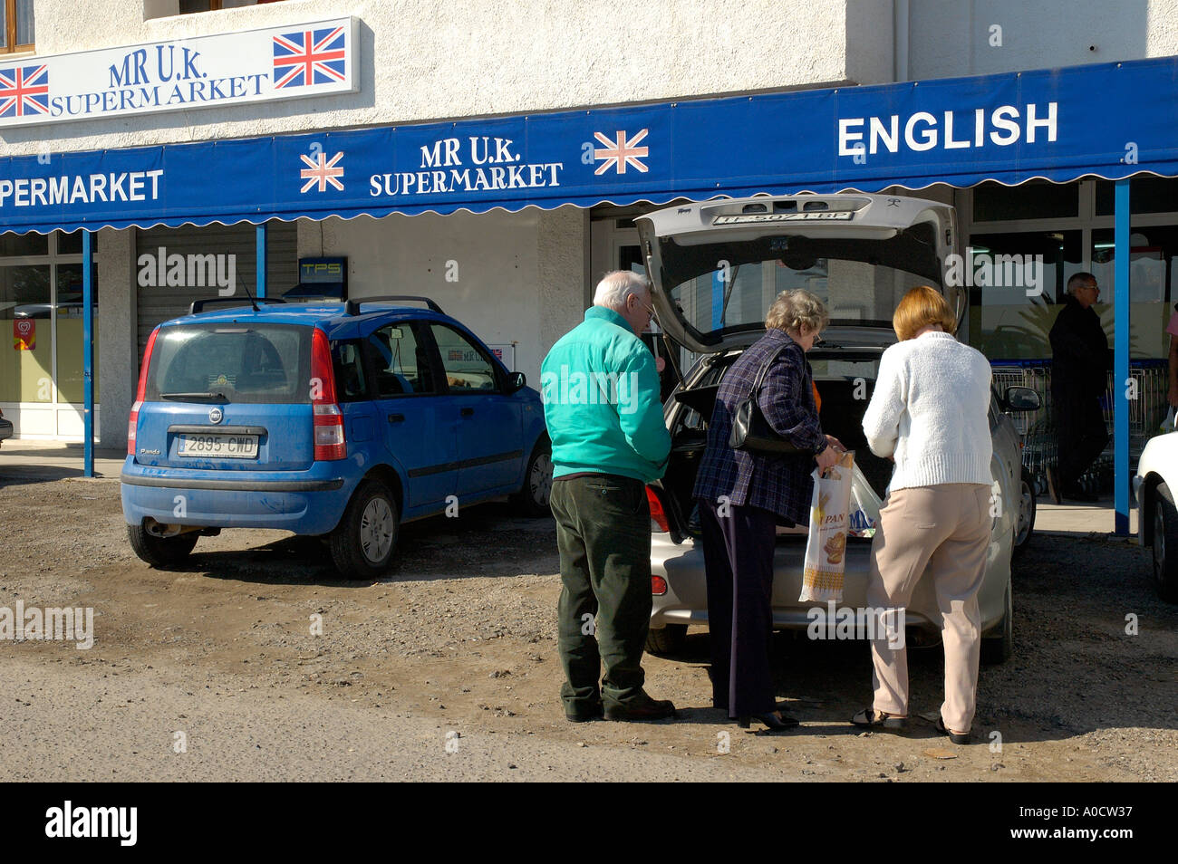Retired British expats shopping at an English supermarket in Spain Stock Photo