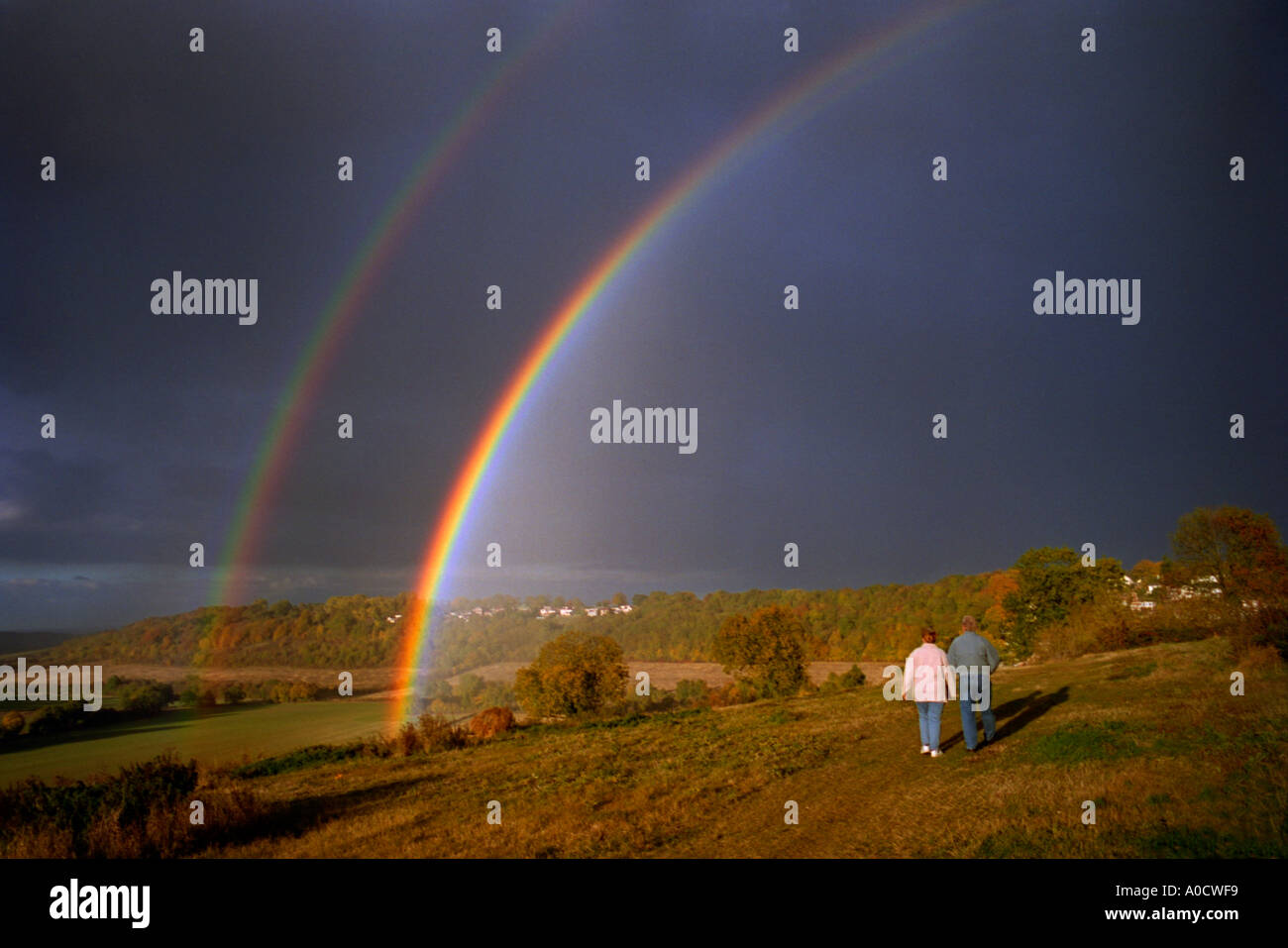 Rainbow against dark skies hi-res stock photography and images - Alamy