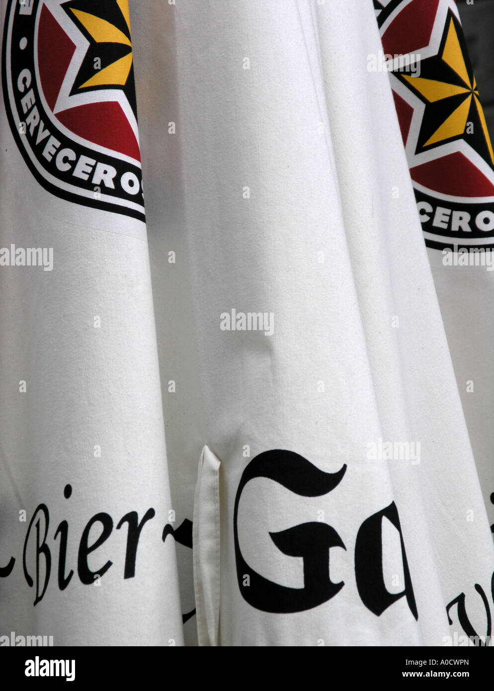 Folded beer parasol with bier and logo Stock Photo Alamy