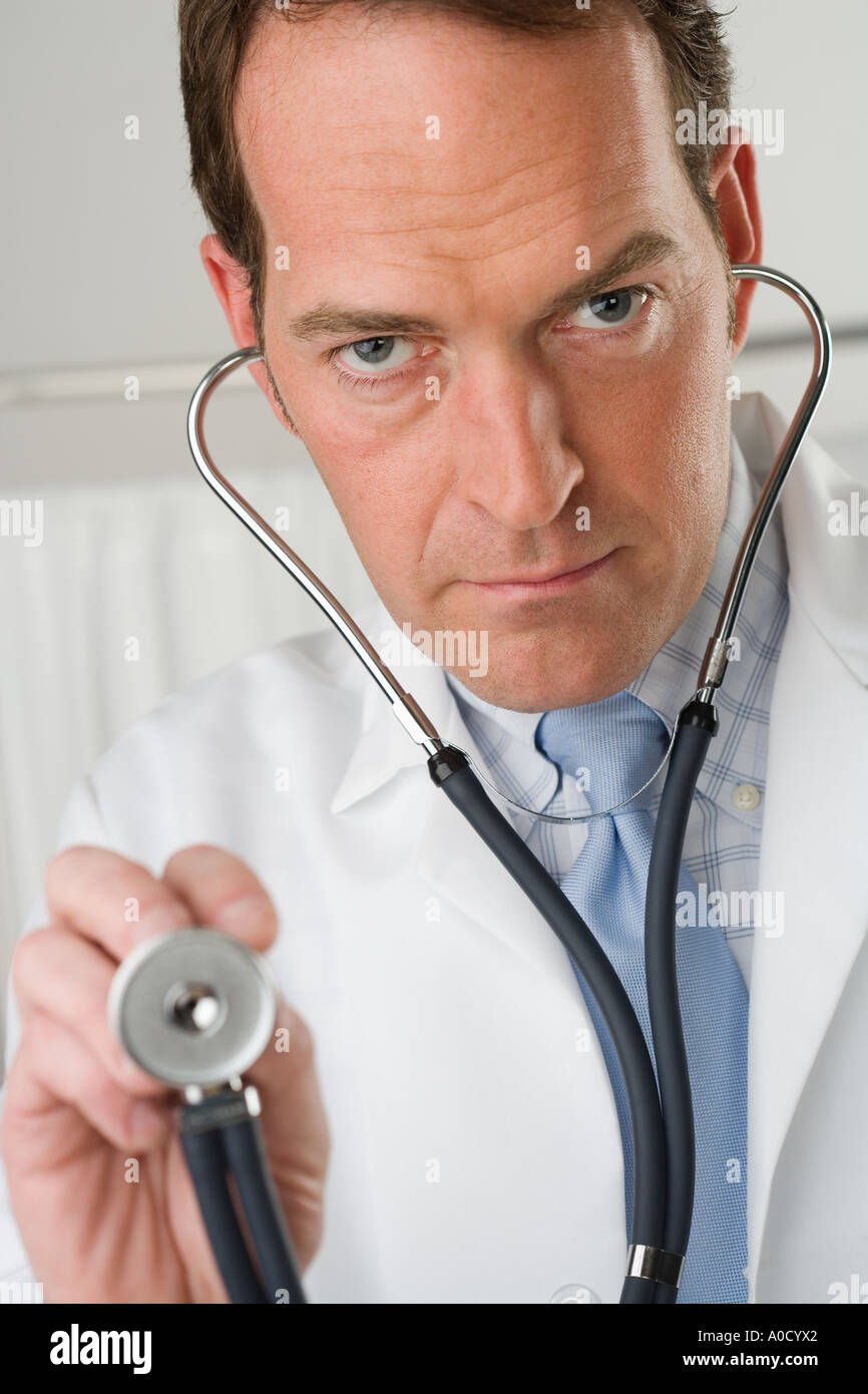 Doctor holding stethoscope Stock Photo