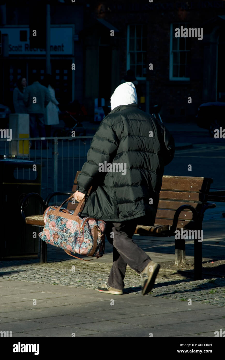 home less man walking and holding his bag Stock Photo - Alamy