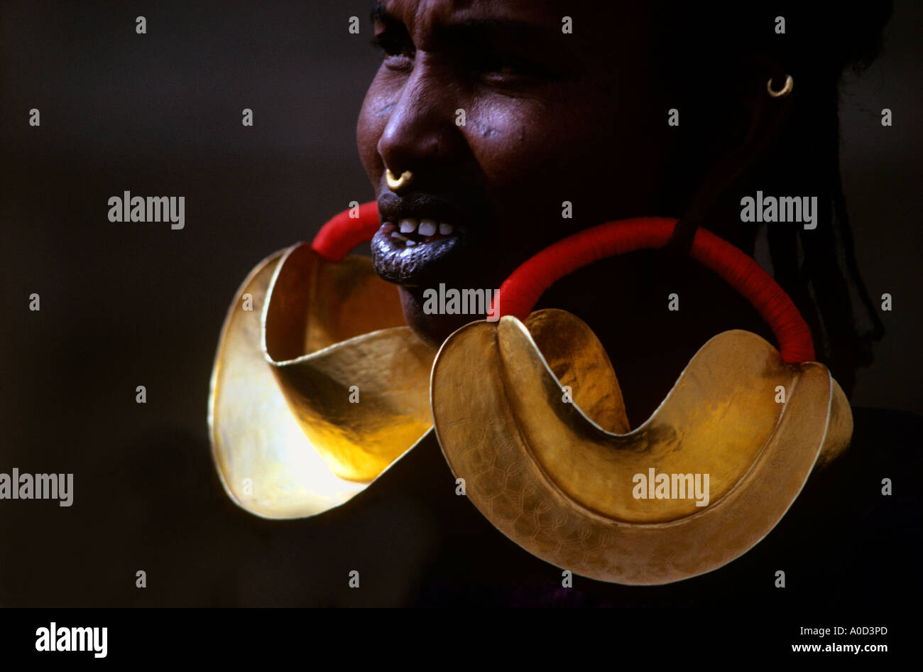 Fulani Woman wearring huge gold earrings Kwottenai Kanye made from