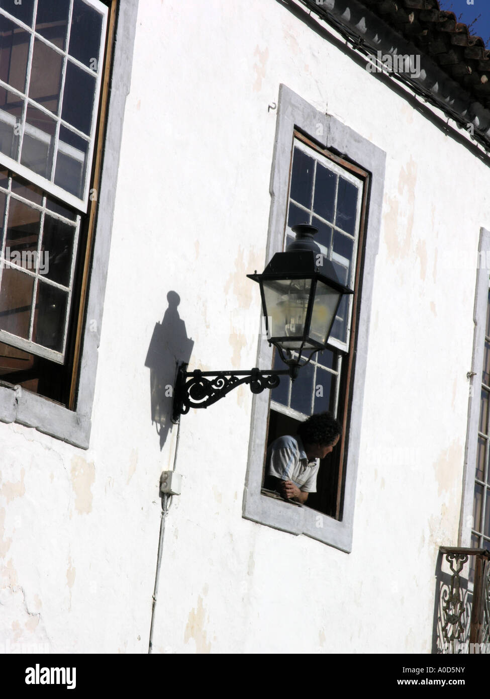 Man leaning out of window hi-res stock photography and images - Alamy