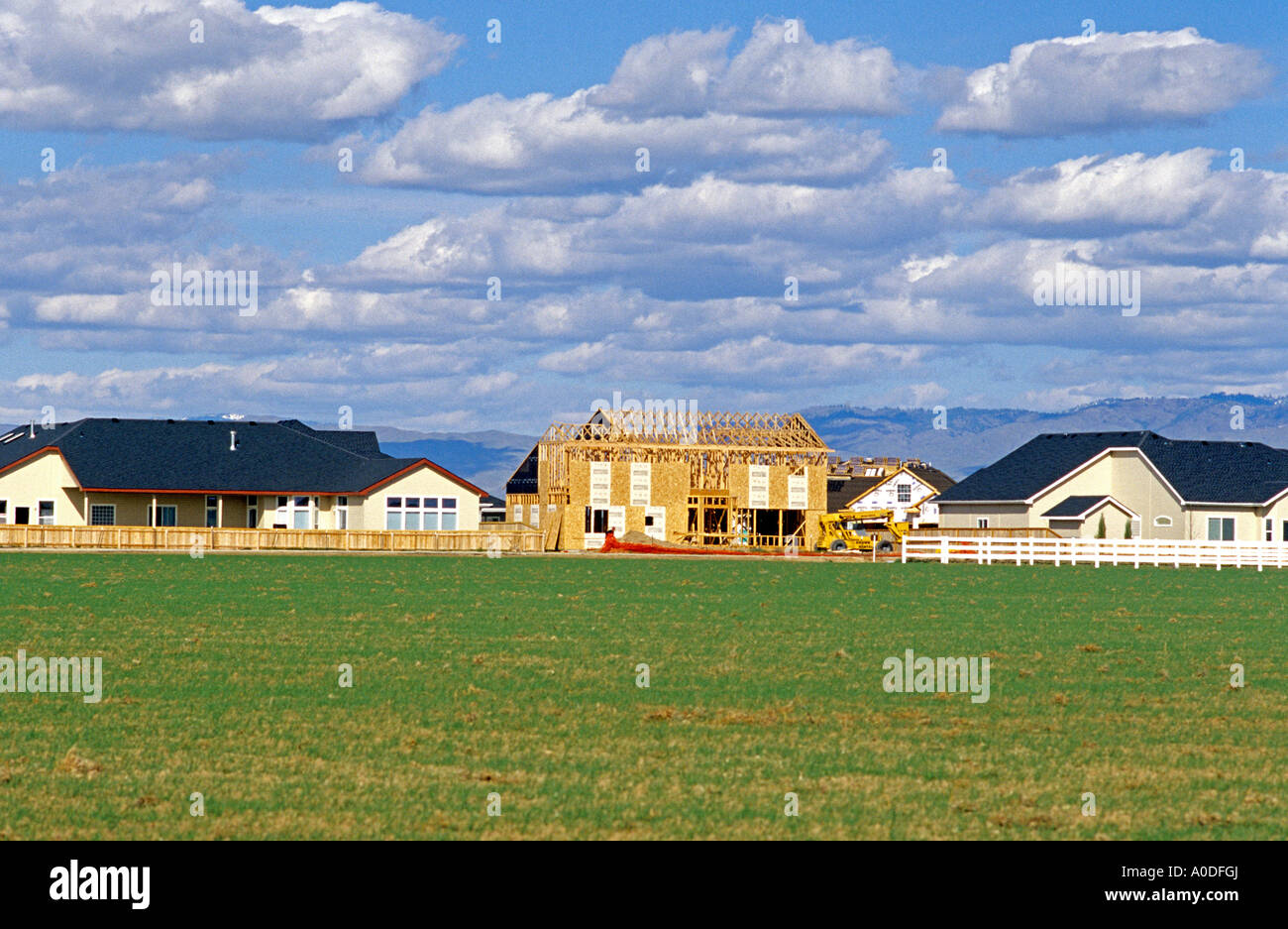 Housing development with completed homes and one still under construction near Boise Idaho Stock
