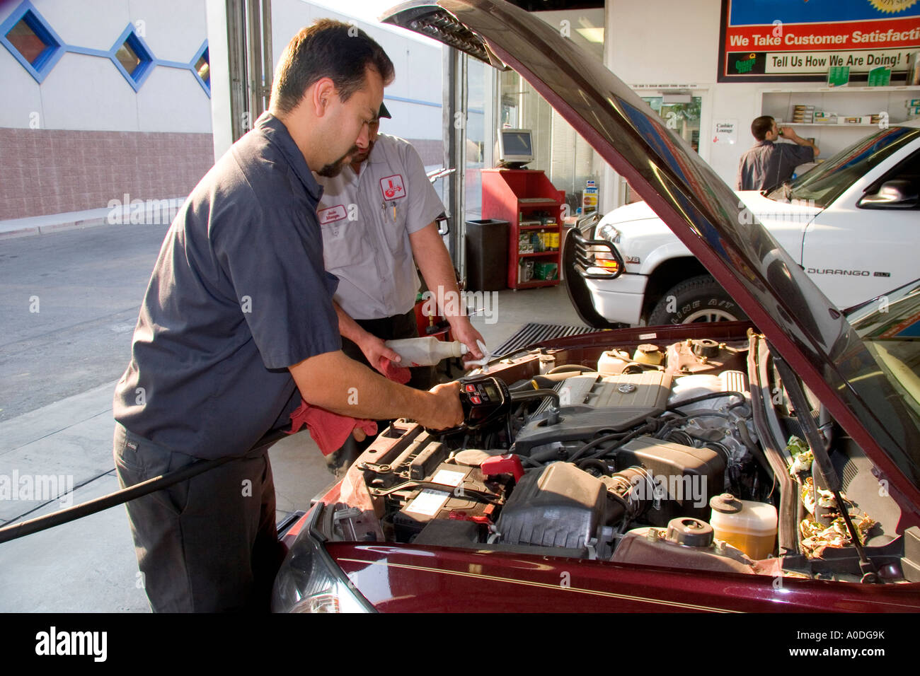 Mechanics giving an automobile an oil change in Boise Idaho Stock Photo