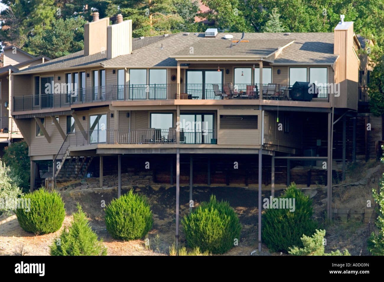 Home built on a hillside using stilts for foundation support in Boise