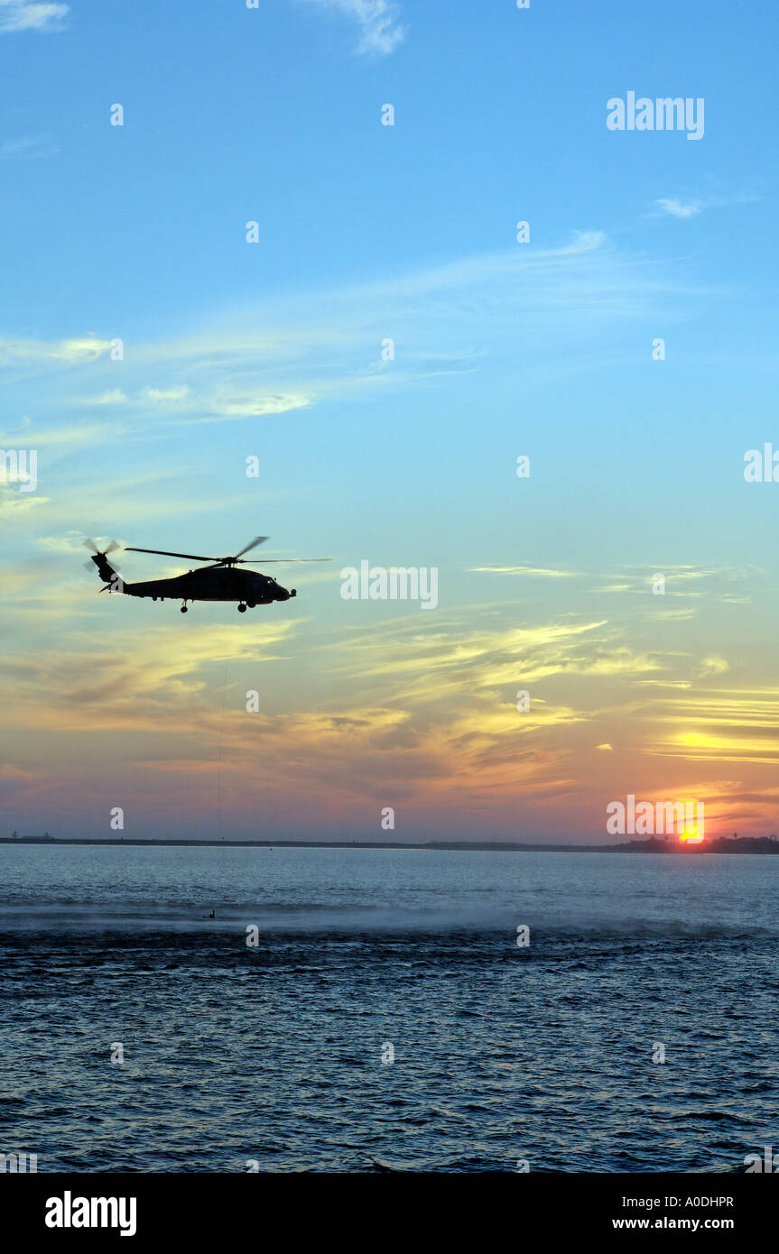 A Portrait Photograph of a Military Exercise Being Undertaken in San Diego Harbour, California, at Sunset Stock Photo
