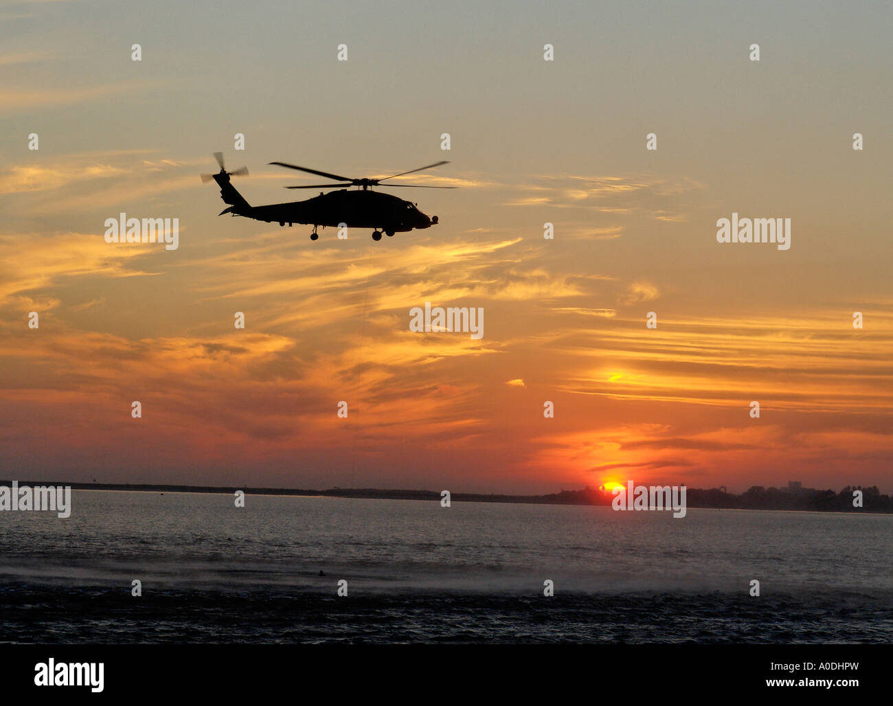 A Military Exercise Being Undertaken at Sunset in San Diego Harbour, California, Photographed in Landscape View Stock Photo