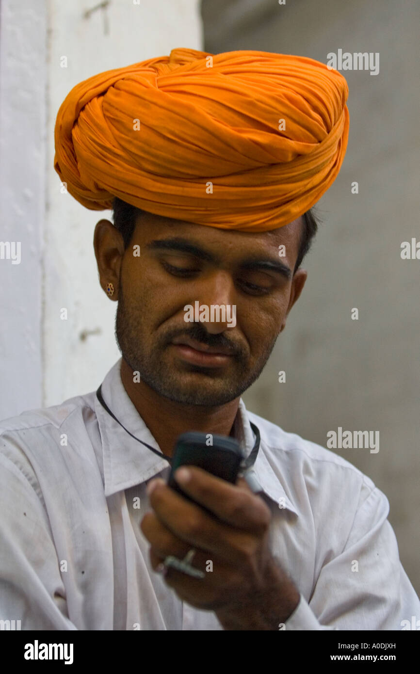 Sadhu on a mobile phone, India Stock Photo