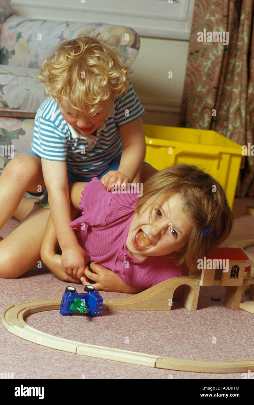 children fighting over toys Stock Photo Alamy