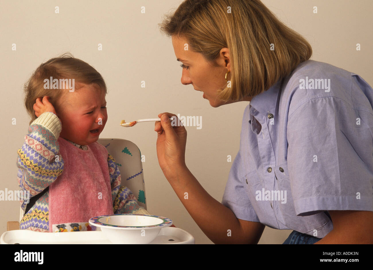 toddler refusing food offered on a spoon Stock Photo Alamy