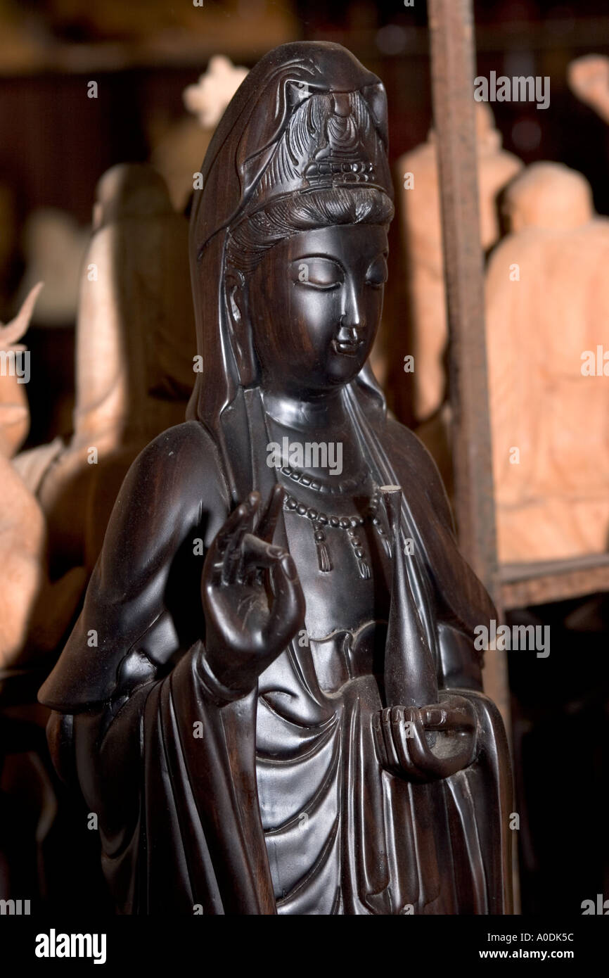 Vietnam Hoi An Old Town Pho Nguyen Thai Hoc Handicraft Workshop high quality woodcarving of religious figure in ebony Stock Photo
