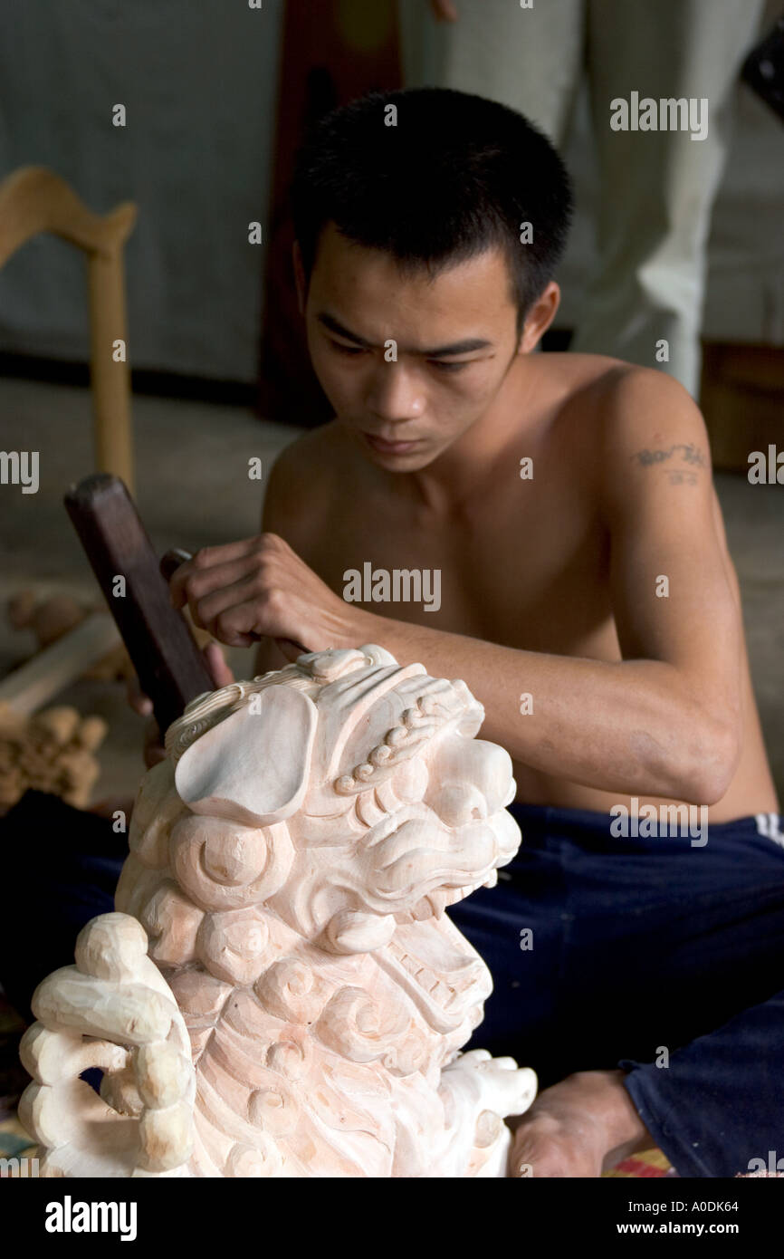 Vietnam Central Hoi An Old Town crafts Kim Bong Traditional Carpentry workshop man carving lion in jackfruit wood Stock Photo