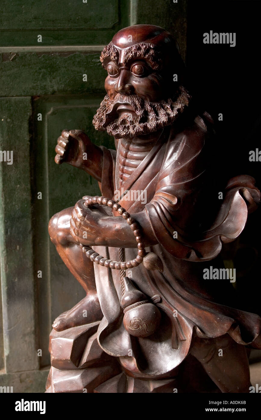 Vietnam Hoi An Old Town crafts Kim Bong Traditional Carpentry workshop high quality carving of holy man in mahogany Stock Photo