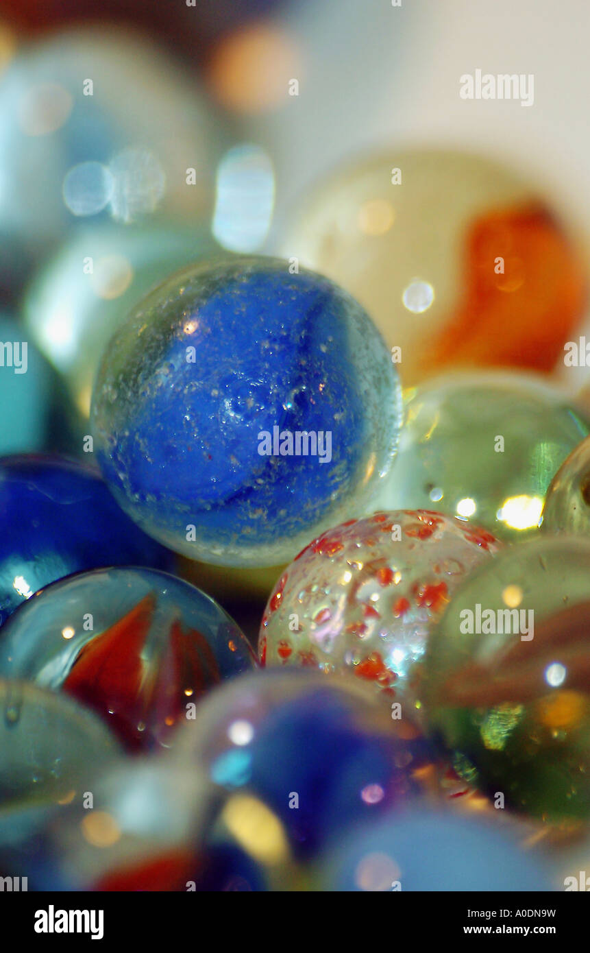 A close up shot reveals the shiny irridescence of individual marbles ...
