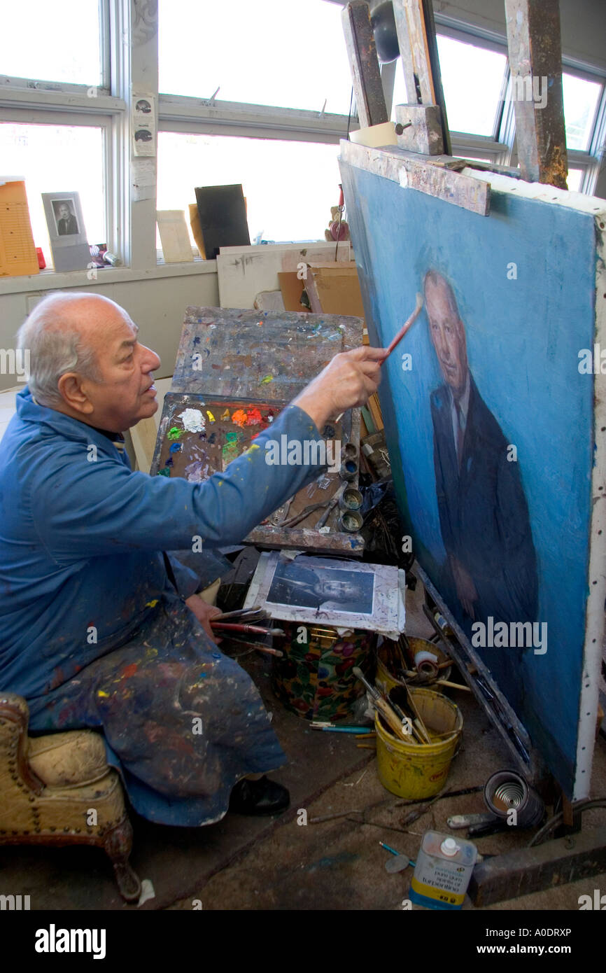 An artist painting a portrait on canvas in Boise Idaho MR Stock Photo