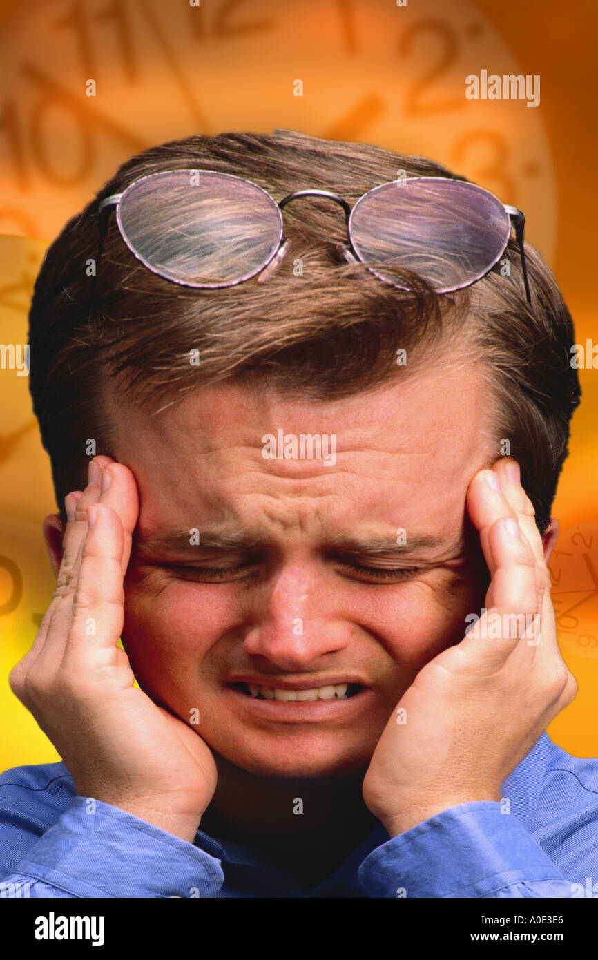 Businessman with exploding headache Stock Photo Alamy