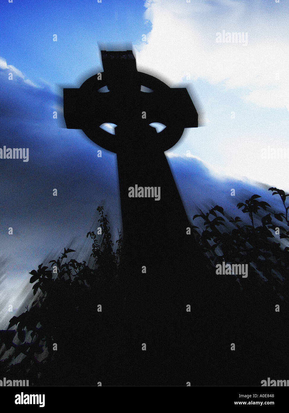 stone cross on grave Stock Photo