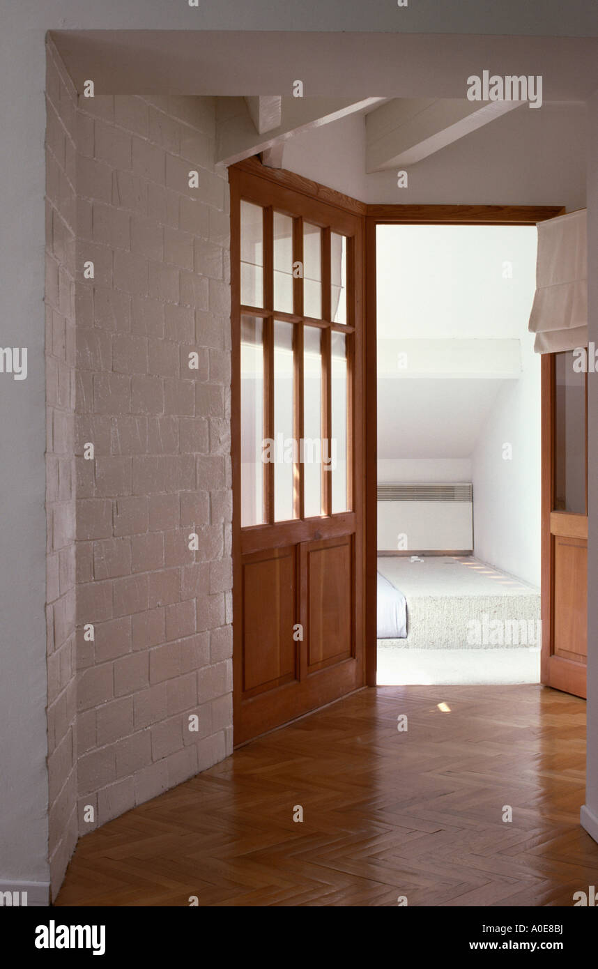 Hall With White Painted Brick Walls And Polished Wooden