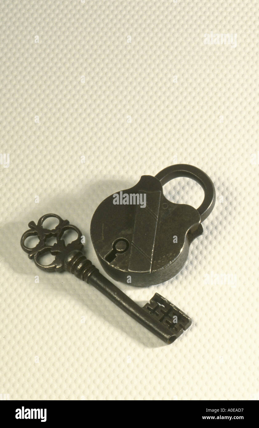Security lock and key on plain background Stock Photo
