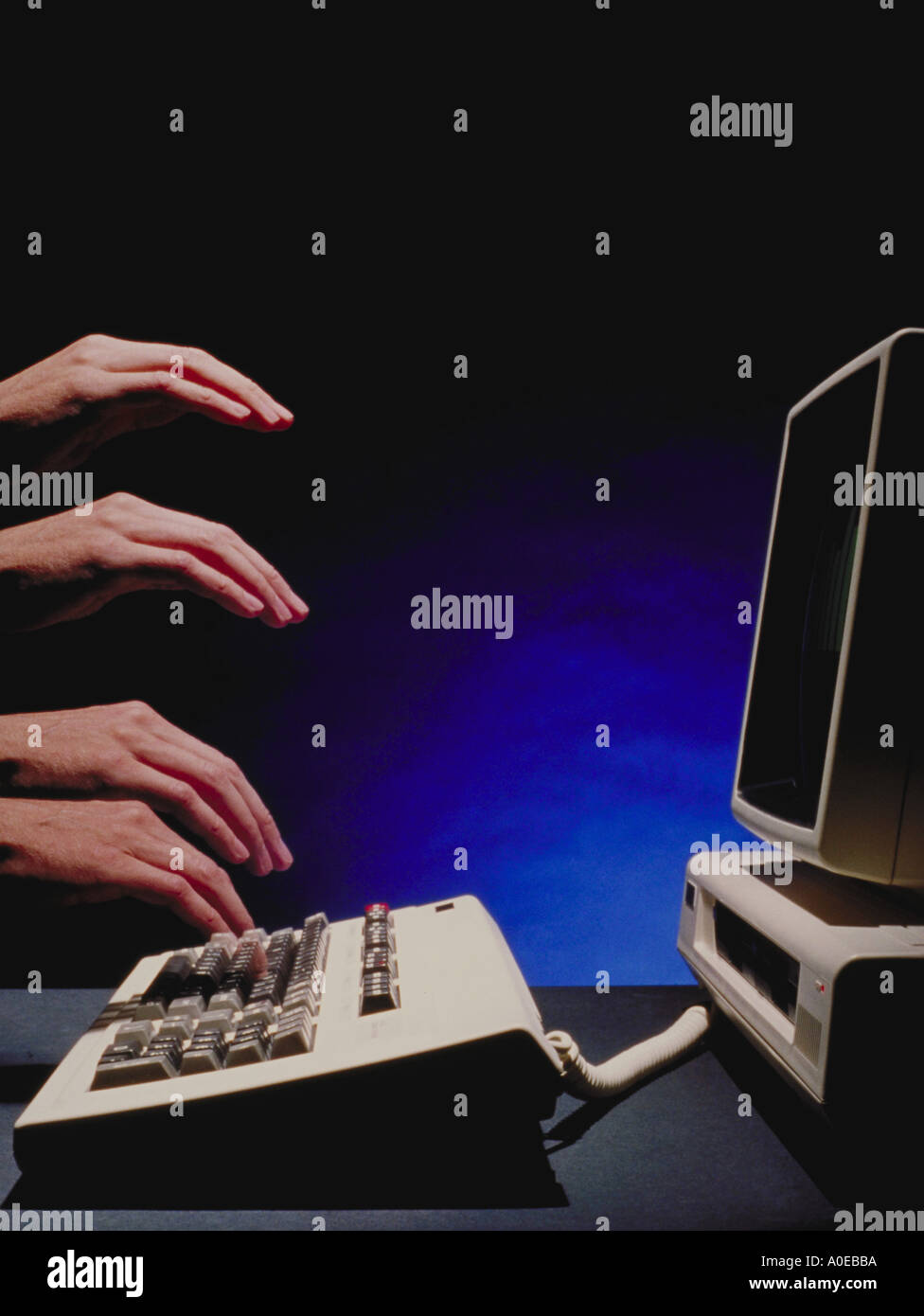 Typing at computer multiple hand effect Stock Photo Alamy