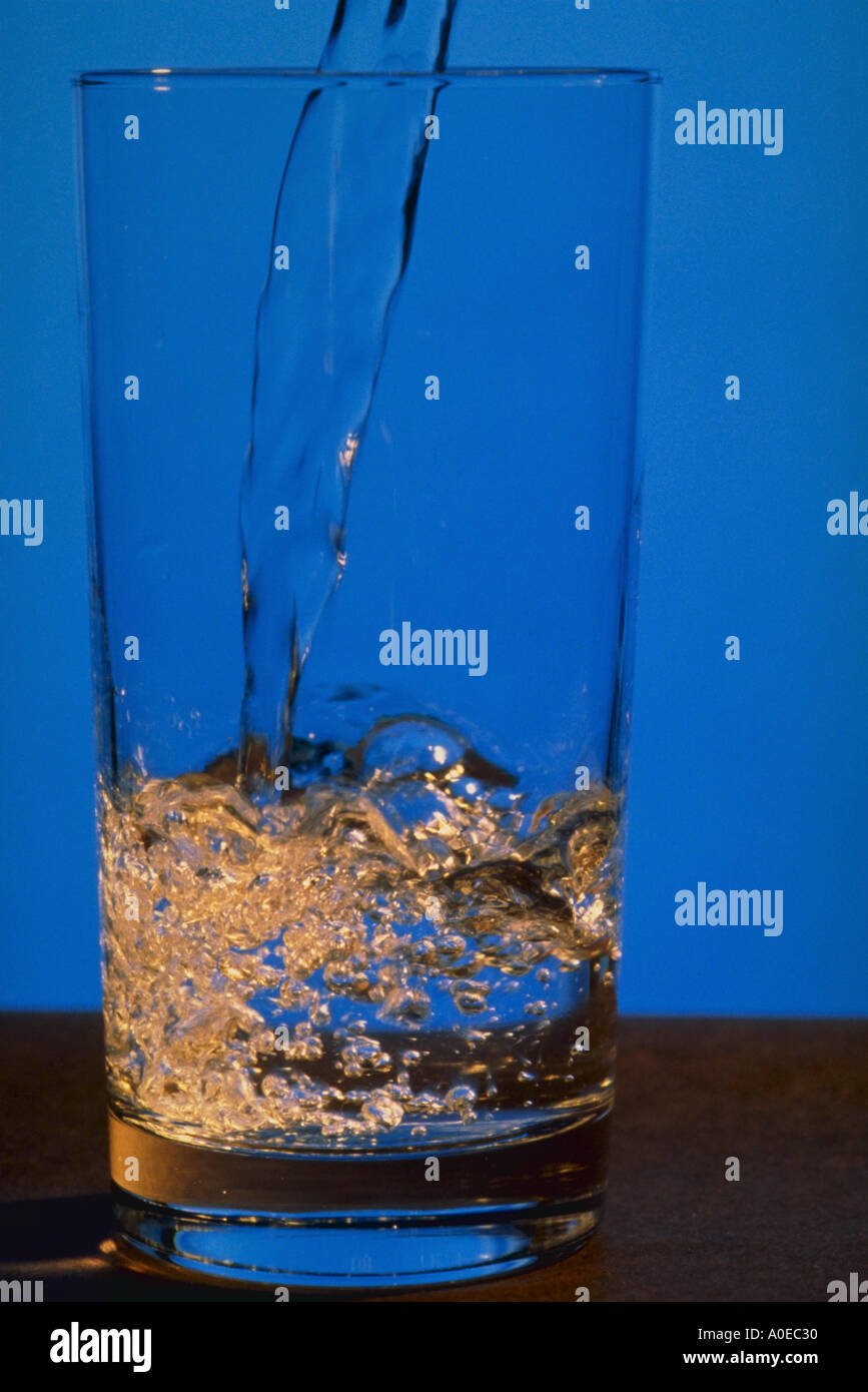 Liquid pouring into glass Stock Photo Alamy