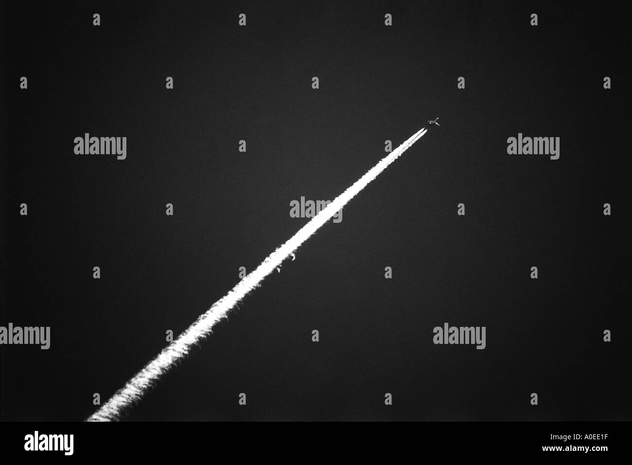 jet with contrail Stock Photo - Alamy