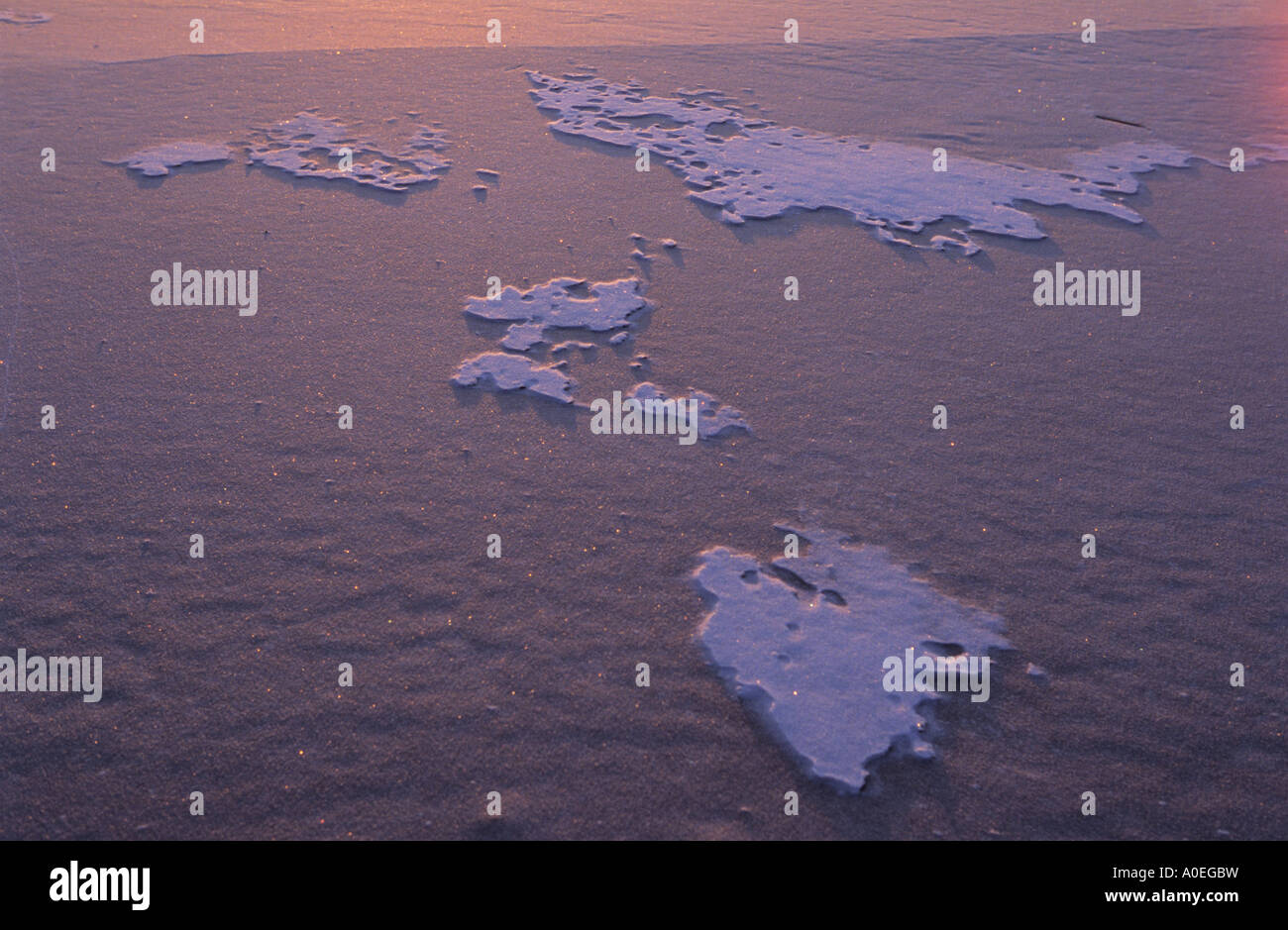 Frozen snow formations on ice Stock Photo