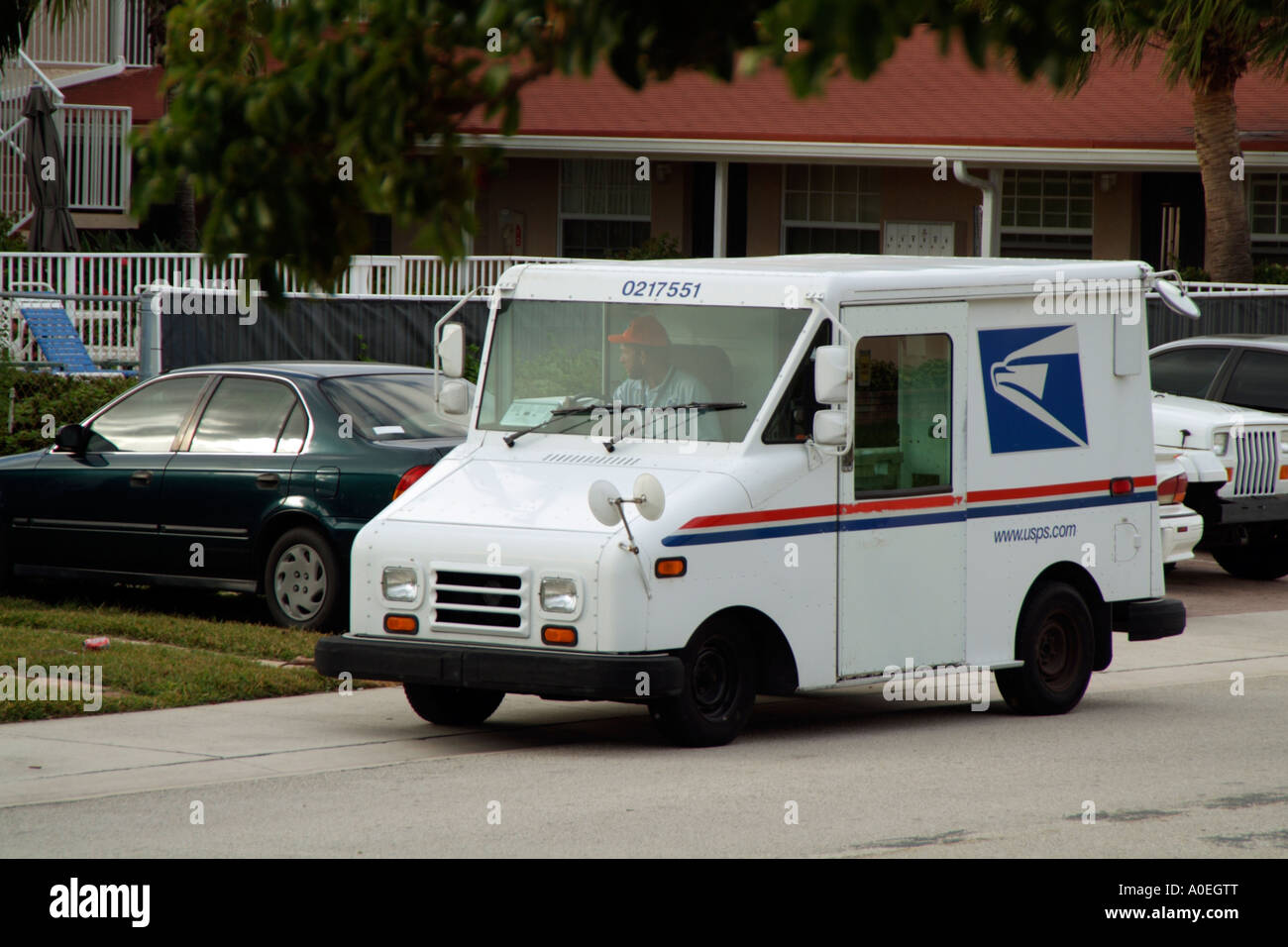 USPS van Postman and delivery van USA American postman and his red