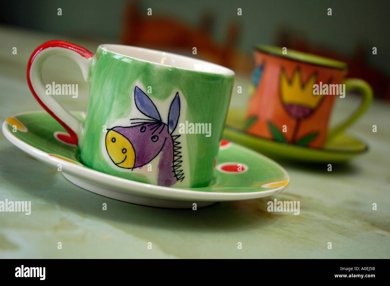 Espresso coffee cups and saucers with vibrant decorations Stock Photo